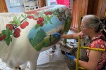 Artist Stacey Kirby painting the Bicentennial Oxen, Wed., July 24